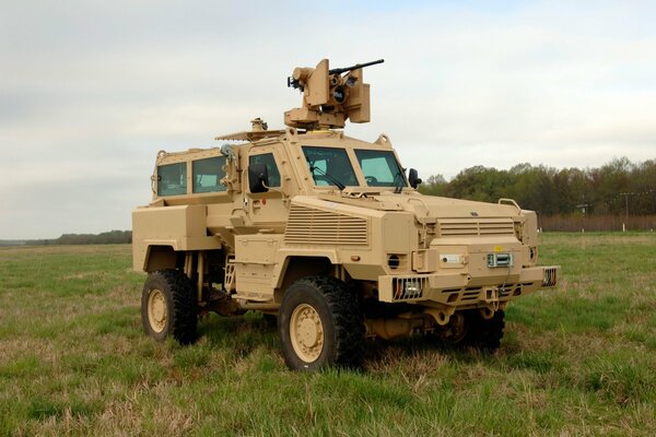 Armored car with weapons in the field