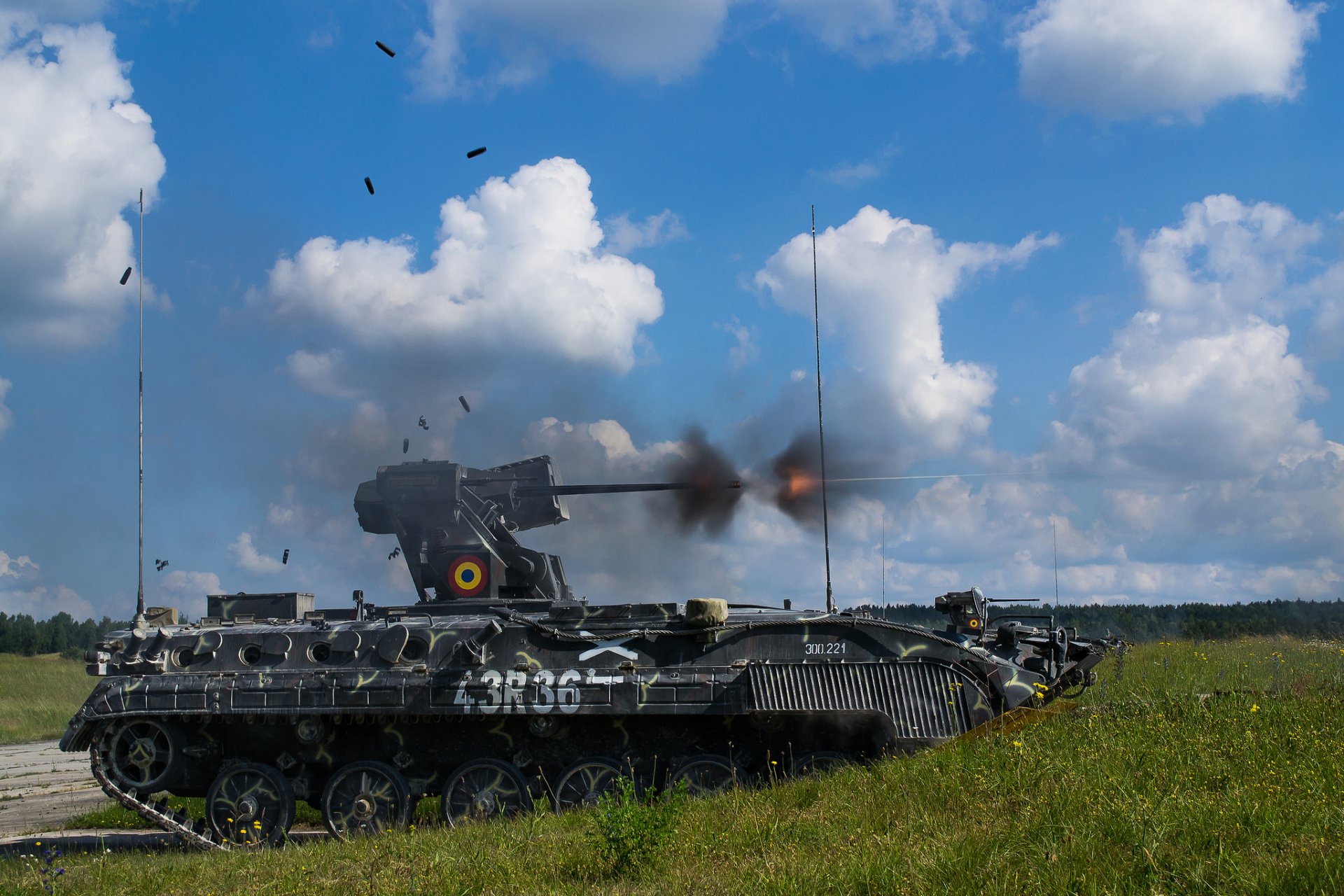 military machine armored vehicles shooting