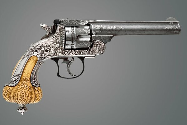 Revolver of 1892 with a gold handle with a crown