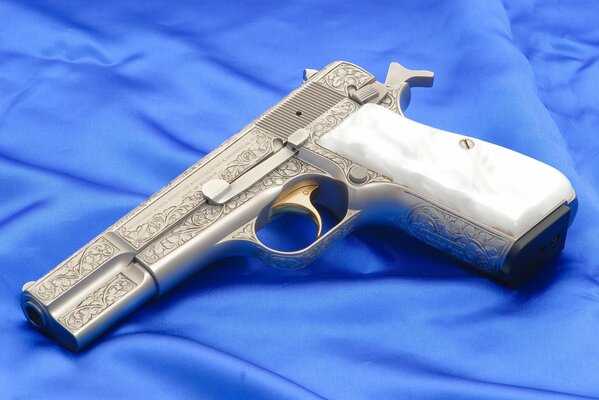 Browning pistol on blue fabric