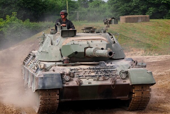 Leopard tank rides on the landfill