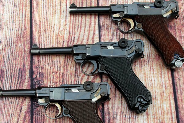 Three parabellum on a wooden table