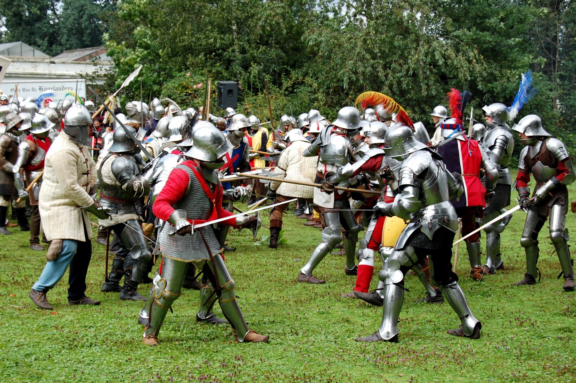 military-historical reconstruction battle battle middle Ages swords shields spears armor helmets grass greenery