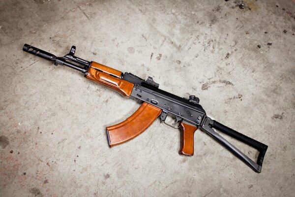 AKS-74 Kalashnikov assault rifle on a concrete floor