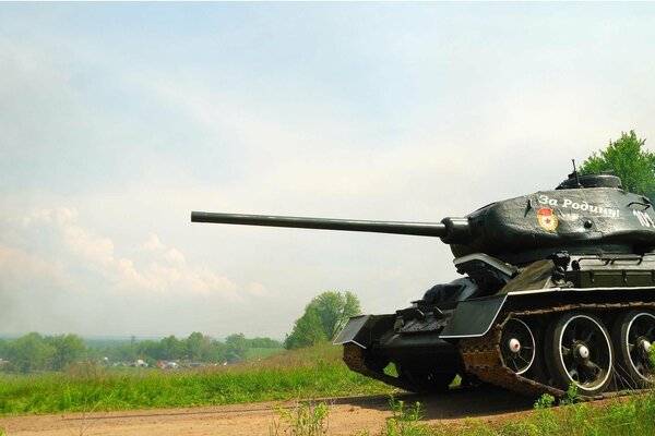 A beautiful Soviet tank rides across the field