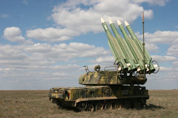 Anti-aircraft missile system in the field under the clouds