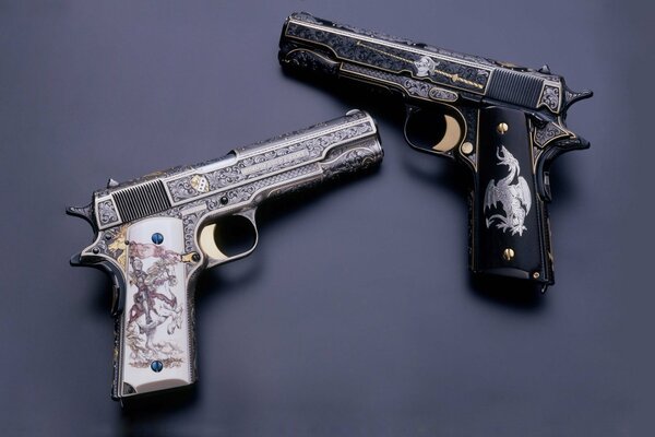 Two pistols with painted dragons on the handles