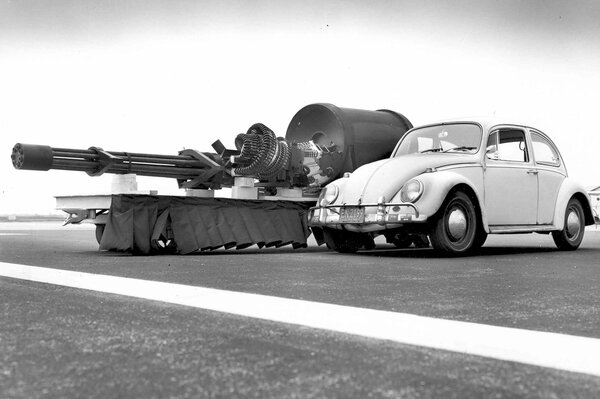 Volkswagen beetle, next to an aircraft cannon
