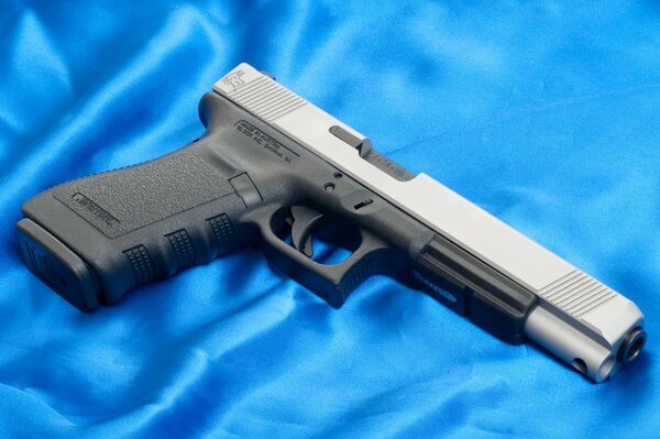 20L glock pistol on a blue background