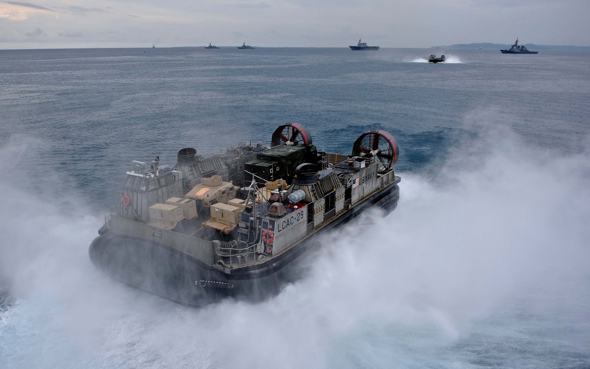 navy ship hovercraft landing to air balloon spray sea