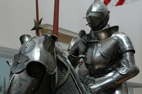 Photo in the museum of a knight in armor on a horse