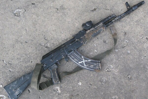 Kalashnikov assault rifle dirty and lost