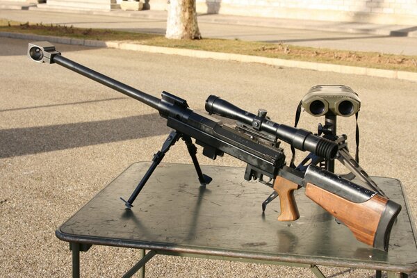 Large-caliber sniper rifle and binoculars