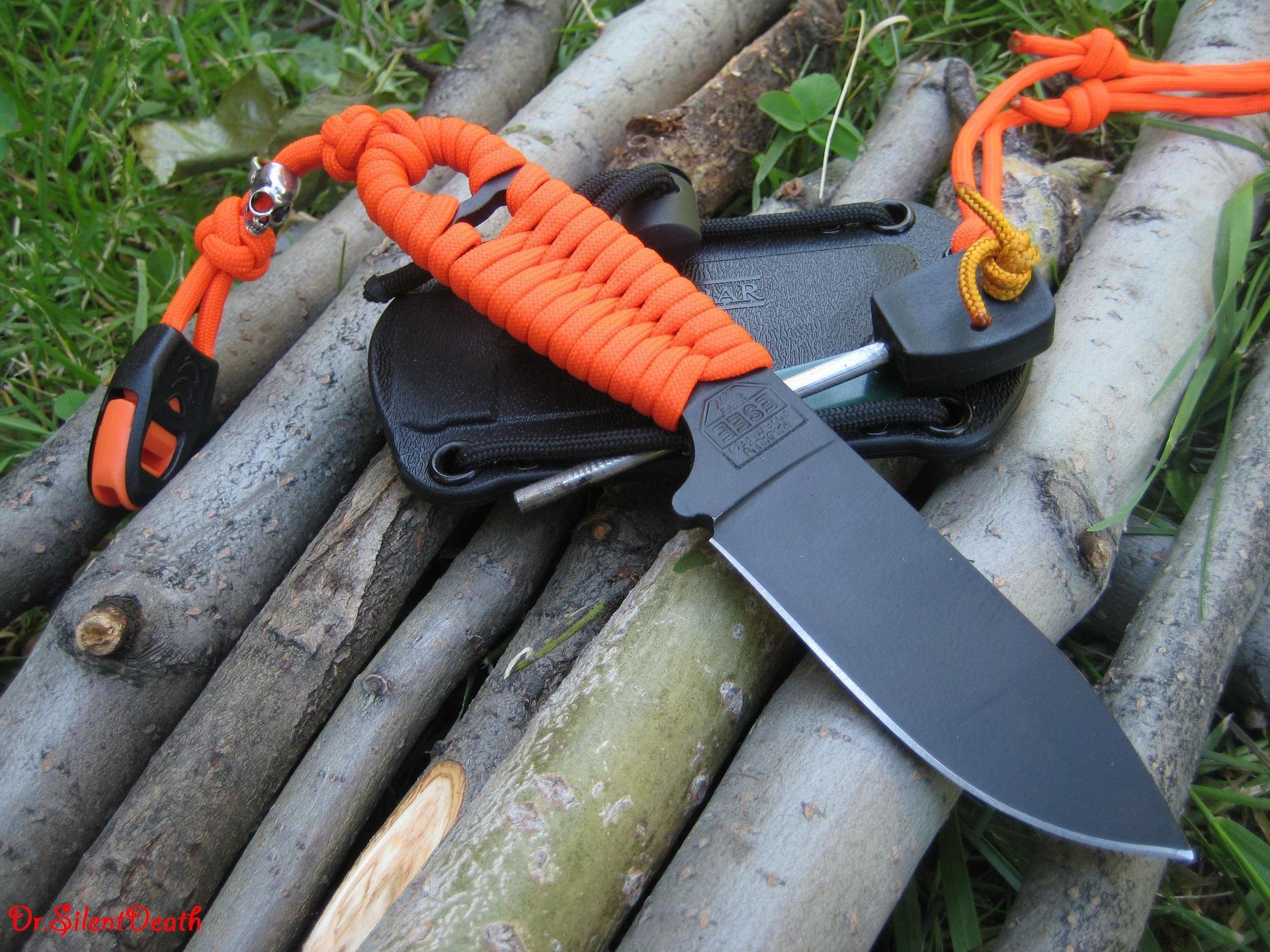 cuchillo hoja vaina cordón naranja