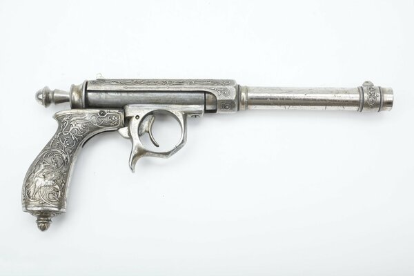 Silver pistol with an unusual handle