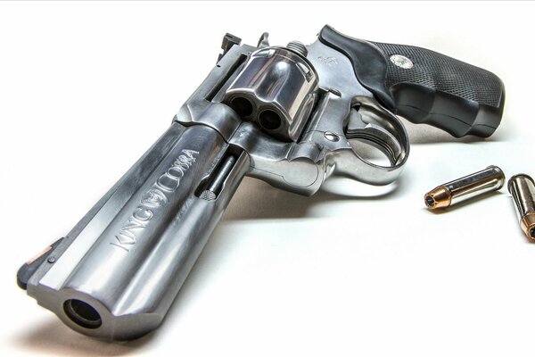 Revolver with cartridges on a white background