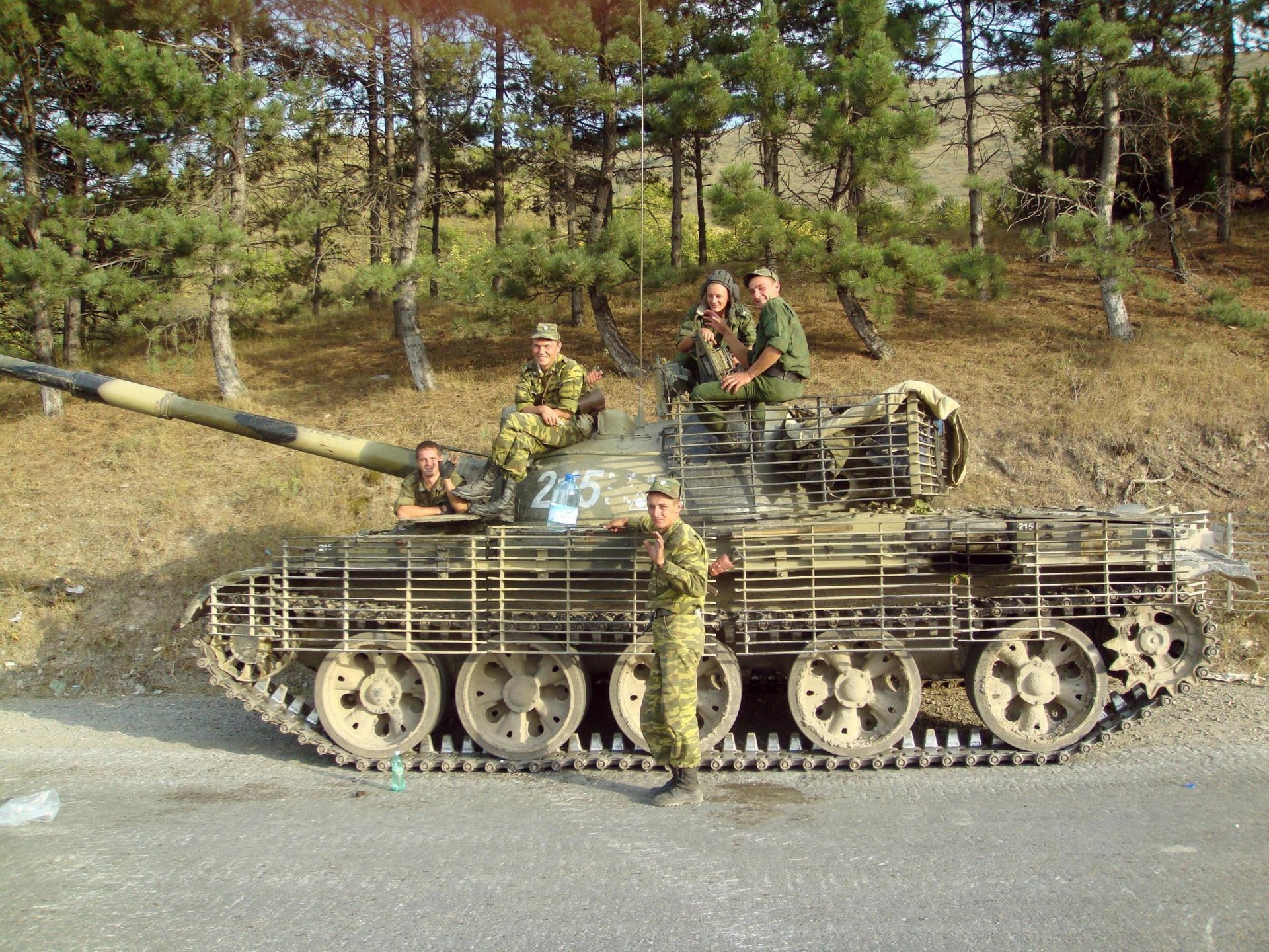 t-62 tank russia men road