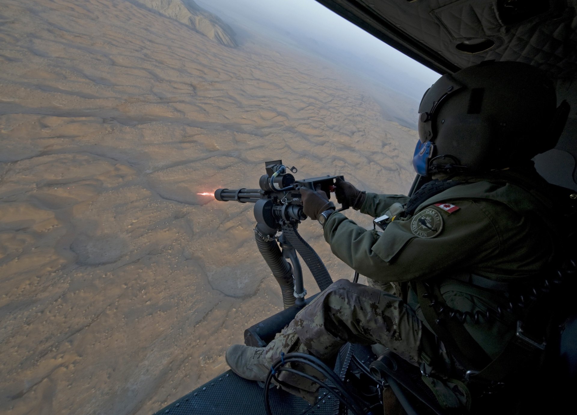 canada soldier machine gun helicopter shelling