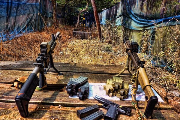 Rifles with ammunition on the wooden floor