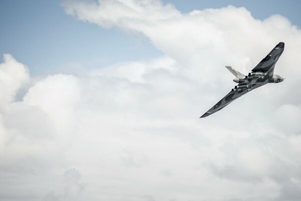 An English plane in flight among the clouds