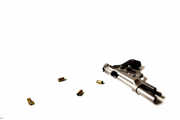 Pistol with cartridges on a white background