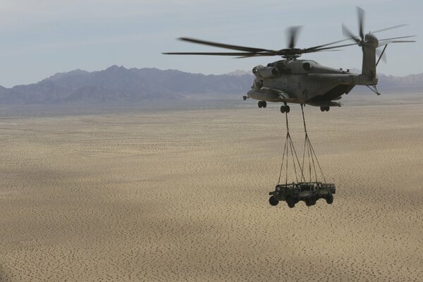 Military heavy helicopter delivers transport