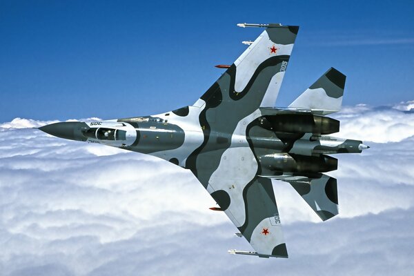 The Russian Su-27 fighter. Power over the clouds