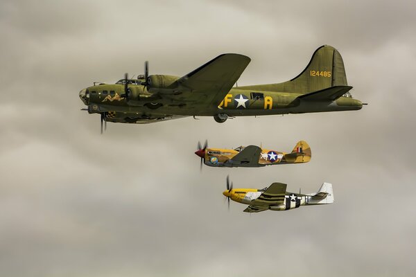 American bomber in the sky against the background of fighter jets