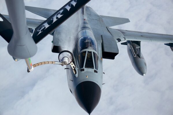 Refueling a fighter in the process of completing a task