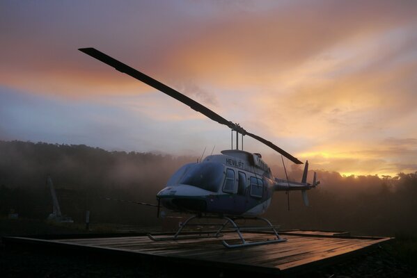 Helicopter landing. Early in the morning, the plane is already ready to respond to