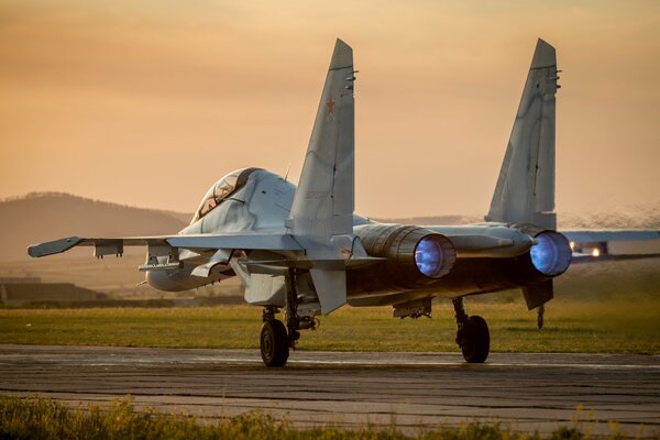 Russian Su-30 aircraft before takeoff rear view