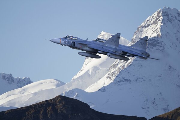 Gripen fighter flight in the mountains