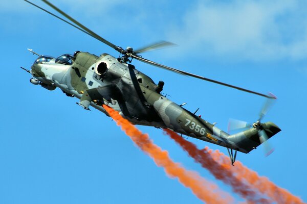 Military helicopter gunship against the sky