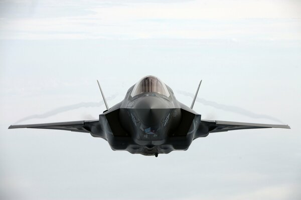 The F-35 fighter-bomber flies into the frame