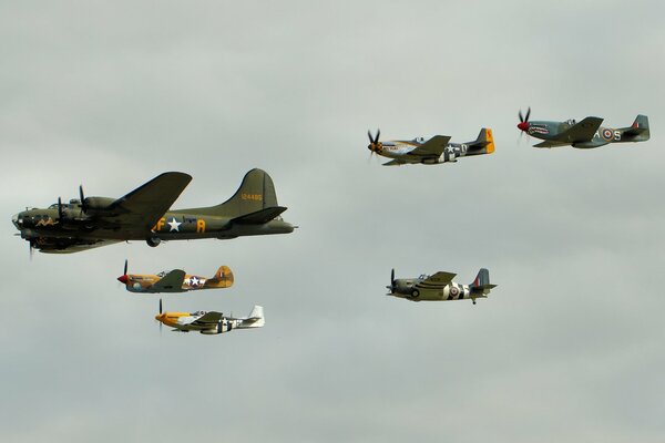 Bomber and fighters in flight