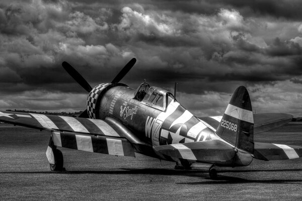 An old photo of a combat fighter at the airfield