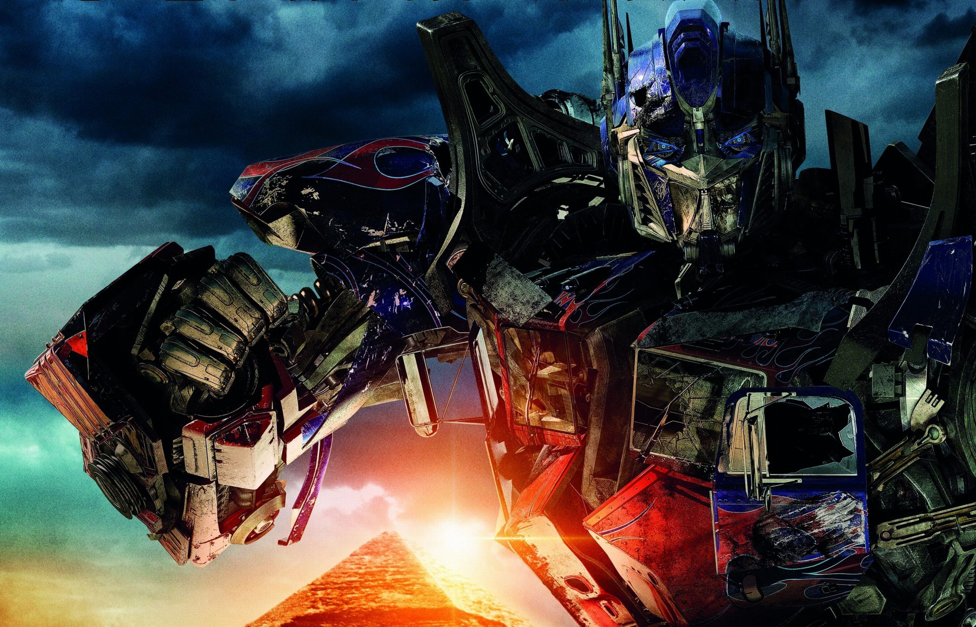 transformers 2 zemsta upadłych film michael bay optimus prime bitwa transformers fantastyka niebieskie oczy autoboty roboty broń egipt niebo piramida słońce chmury