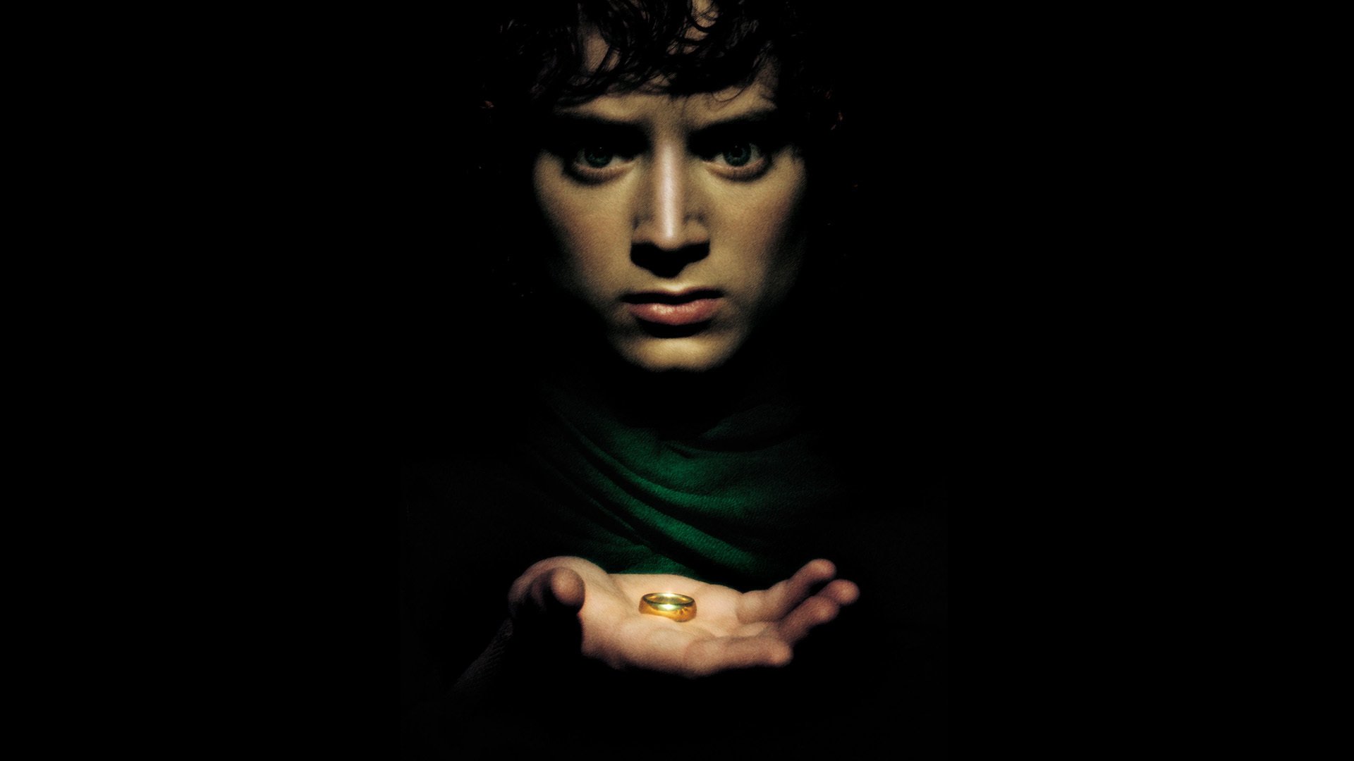 elijah madera frodo el señor de los anillos el señor de los anillos el hobbit fantasía tolkien john anillo actor negro fondo asustado mirada mano