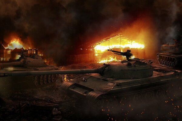 The tank stands against the background of a burning house on fire