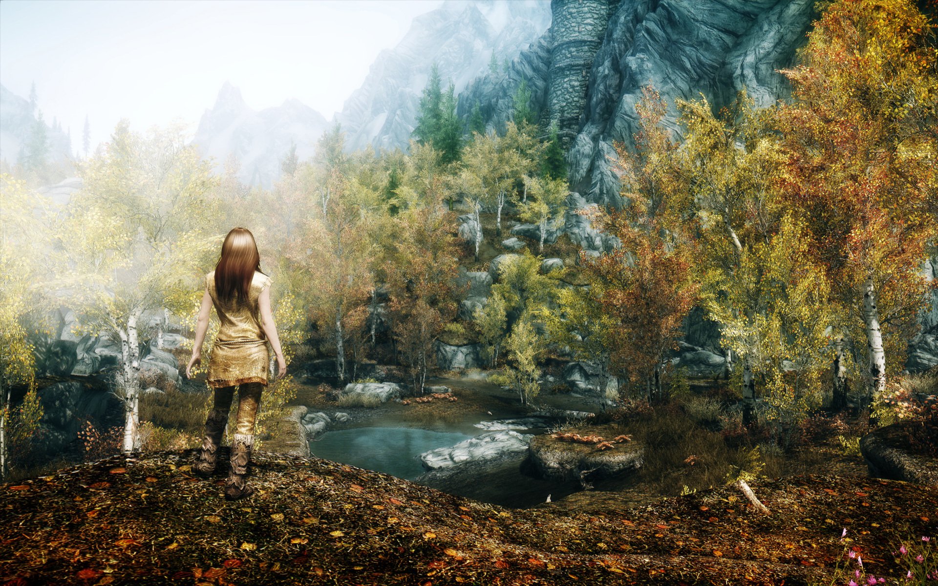 kyrim jeu fille nature montagnes rochers arbres plan d eau