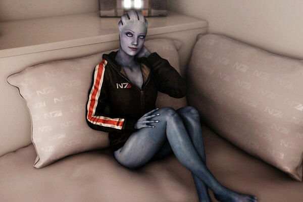 Azari from mass effect is sitting smiling on the couch