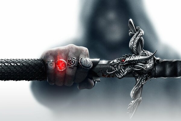 Dragon age3 ręka z 4 sygnetami i mieczem w ręku
