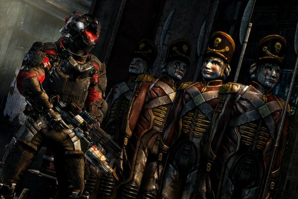 Gioco Dead space 3. Un soldato in armatura si trova accanto a un soldato di latta