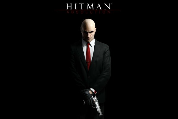 Hitman con una pistola sobre un fondo negro