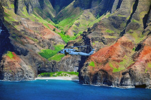 American ship-based multi-purpose helicopter MH-60s on the background of mountains