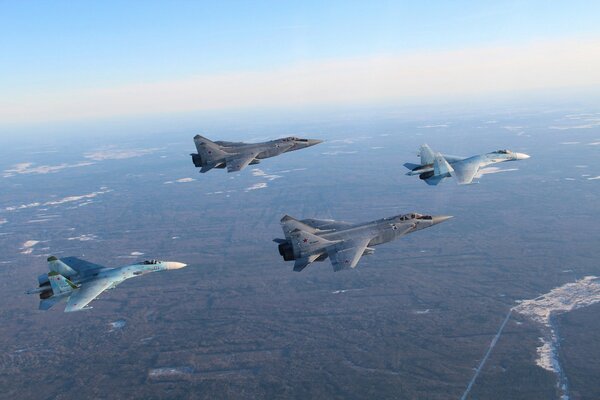 Su-27 and mig-31 fighters in the sky