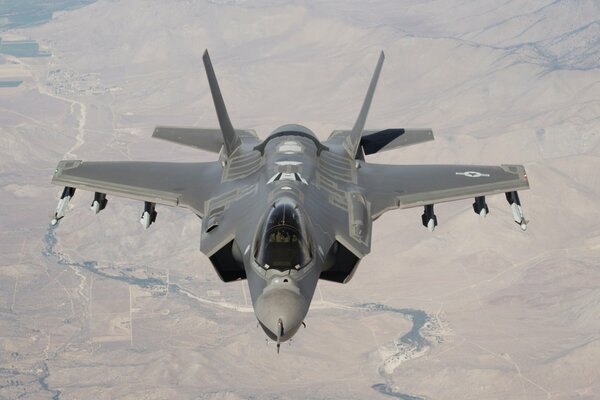 Lightning ii flies over the ground top view