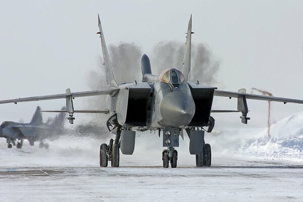 The Air Force interceptor military samalet took off on a winter road