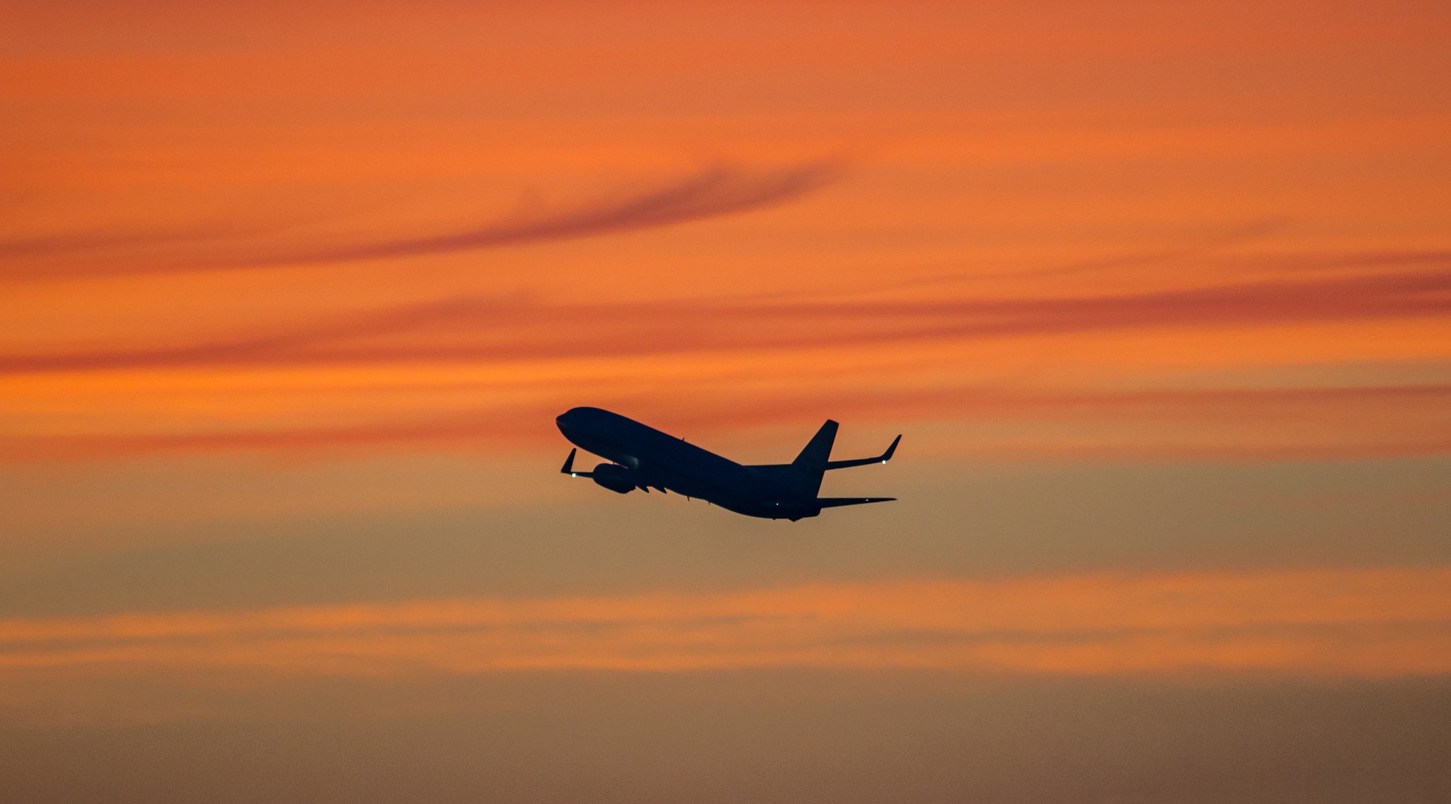 plane liner sky clouds glow