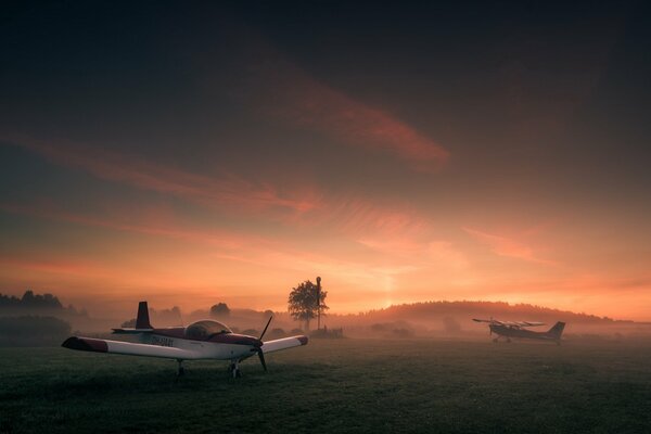 A small plane in the sunset